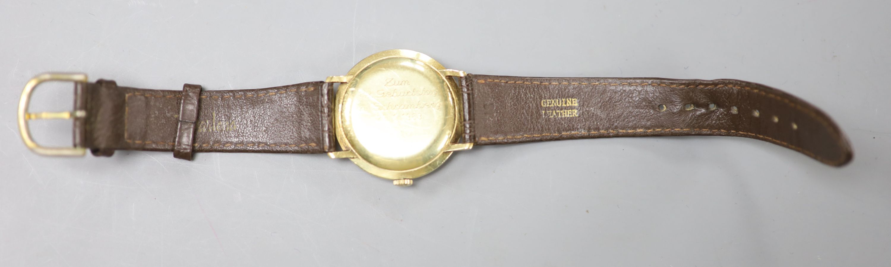 A gentlemans 14ct Junghans Meister manual wind wrist watch, on a associated leather strap and case back inscription,